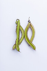 Purple winged bean vegetable (Psophocarpus tetragonolobus) on white background