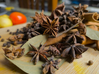 Close up shot of Spices on the wooden surface.
