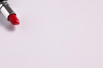 Fototapeta na wymiar Red lipstick tube on white background, copyspace