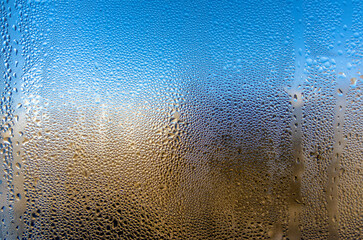 water drops on glass surface close up
