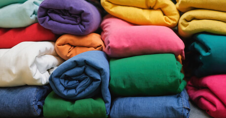 Colorful pile of freshly folded laundry from the laundry room