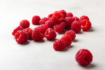 Raspberries on a light background