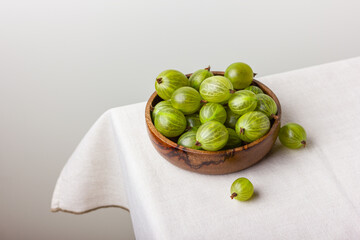 Gooseberry in a wooden bowl
