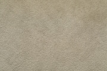 Fototapeta na wymiar Texture of soft beige fabric as background, top view