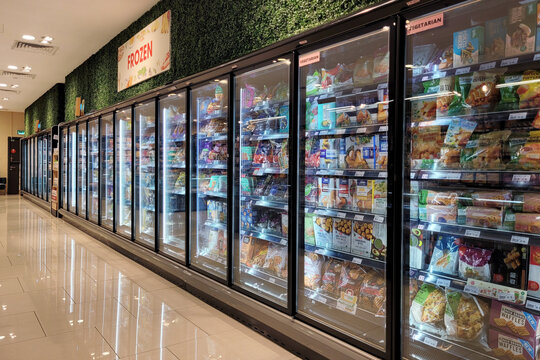Kuala Lumpur, Malaysia - 12 FEB 2024: An interior view reveals a large fridge filled with various brands of local and imported frozen food at Jaya grocery store in Lalaport.
