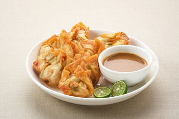 Batagor, made from fish or chicken dumpling, tofu, tapioca flour served with peanut sauce. Indonesian food
