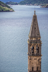 Bell tower of Saint Nicholas Church in Perast historical town in Kotor Bay on Adriatic Sea,...