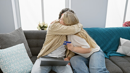 A loving embrace between a man and woman, holding a credit card, inside a cozy, modern living room. - Powered by Adobe