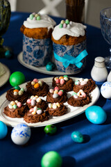 Holiday Easter homemade cookies in shape of nests with colorful sugar eggs