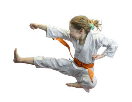 Young girl practicing karate kick - Powered by Adobe
