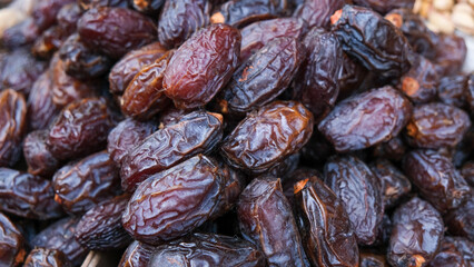 The close up surface texture of dried dates fruits.