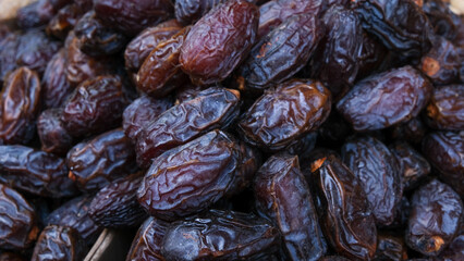 The close up surface texture of dried dates fruits.