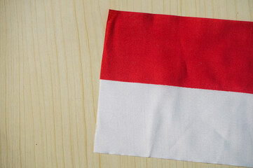 Indonesian flag isolated on wood background