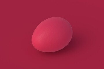 Egg of magenta on red background. 3d render