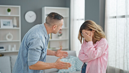 Man and woman couple arguing at home