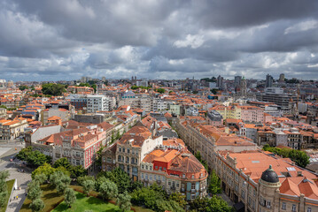 Fototapeta na wymiar Aerial view from tower of Clerigos Church in Porto city, Portugal with Jardim das Oliveiras park on foreground