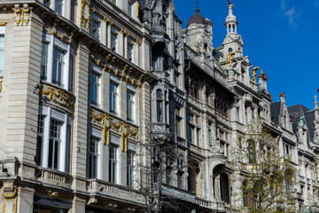 Fototapeta na wymiar Antwerp, Belgium. 15 April 2023. Facades of Antwerp, old historical buildings in the centre of the city. Decorated with golden statues at Grote Markt of Antwerp