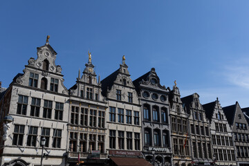 Antwerp, Belgium. 15 April 2023. Facades of Antwerp, old historical buildings in the centre of the city. Decorated with golden statues at Grote Markt of Antwerp