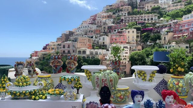 Positano, tourist destination on the Amalfi Coast, Italy. Aerial view of Colorful houses on a Tyrrhenian sea coast seen through green juicy flora in Positano 