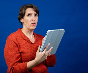 Worried Woman working on a tablet