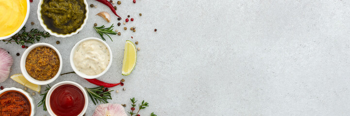 Different types of sauces in bowls with seasonings banner, rosemary and pepper, thyme and garlic,...