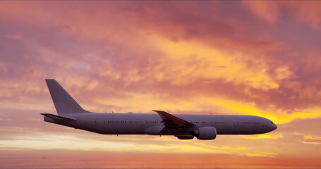 Close-up of Large airliner with passengers is flying on purple sky of bright sunset on sunny summer...