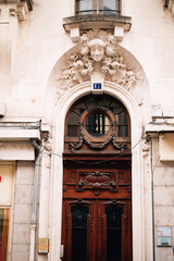 Fototapeta na wymiar antique wooden doors and stucco above them