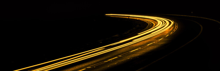 orange car lights at night. long exposure