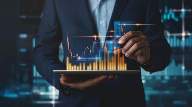 Business man holding tablet and showing holographic graphs and stock market statistics gain profits. Concept of growth planning and business strategy. Display of good economy form digital screen. 