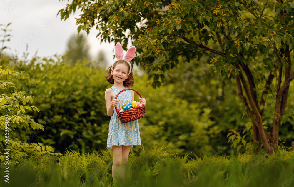 Canvas Prints child with painting eggs outdoors