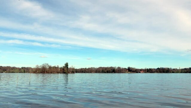 View over the Staffelsee in Bavaria from Uffing to the opposite shore and the Kochel mountains in the Alps