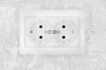 Power electric sockets on a white wall. white electricity rosette on white background. outlet on the white wall