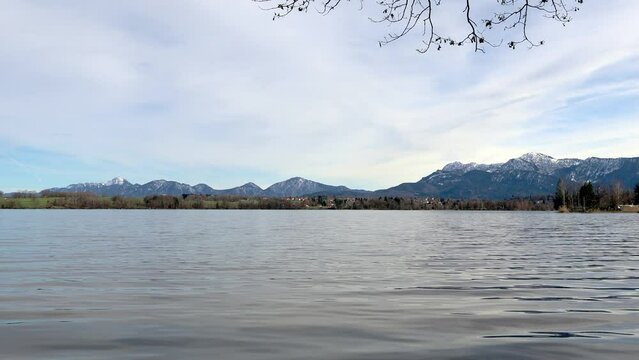 View over the Staffelsee in Bavaria from Uffing to the opposite shore and the Kochel mountains in the Alps