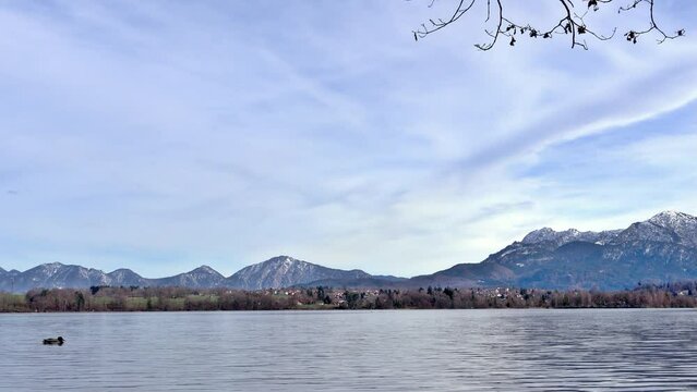 View over the Staffelsee in Bavaria from Uffing to the opposite shore and the Kochel mountains in the Alps