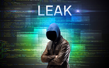 Faceless hacker on code background