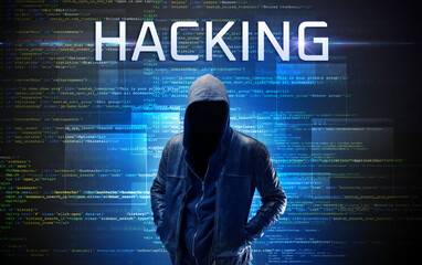 Faceless hacker on code background