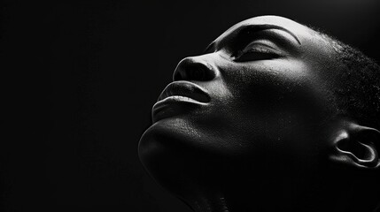 A minimalist monochrome portrait of a person against a stark