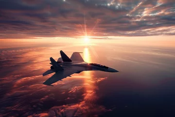 Foto auf Acrylglas flying over the ocean at sunset jet fighter su35 with great speed. new technologies of military combat aviation concept © Kien