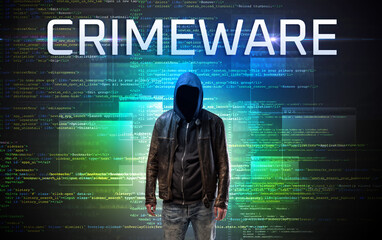 Faceless hacker on code background
