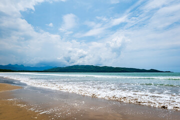 Fototapeta na wymiar Pacitan beach landscape in Java, Indonesia. A popular beach resort for surfing in Indonesia