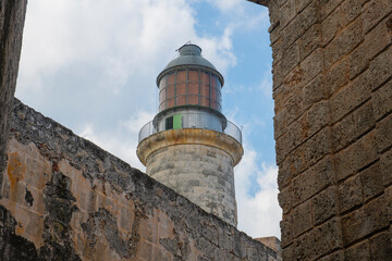 Fototapeta na wymiar Lighthouse (Faro) at Castillo de los Tres Reyes del Morro at the mouth of Havana Harbor in Old Havana (La Habana Vieja), Cuba. Old Havana is a World Heritage Site. 