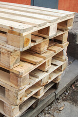 Wooden pallets against wall of store close up