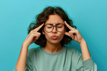 university student in glasses closing eyes and plugging ears with fingers to ignore noise, dumb stupid comments - obrazy, fototapety, plakaty