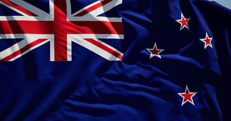 Close-up of the national flag of New Zealand flutters in the wind on a sunny day