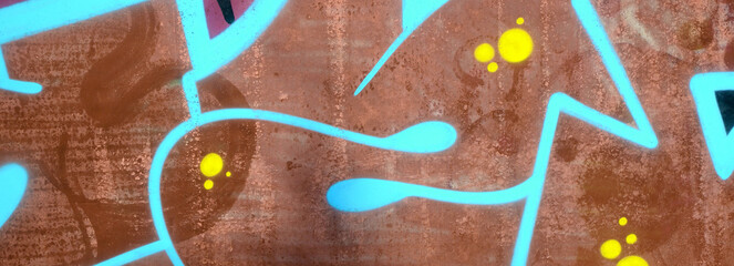 Colorful background of graffiti painting artwork with bright aerosol outlines on wall. Old school...