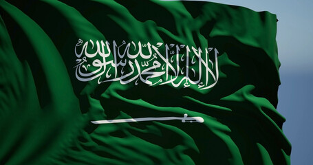 Close-up of the national flag of Saudi Arabia flutters in the wind on a sunny day
