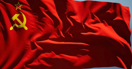 Close-up of the national flag of Soviet Union blowing in the wind on a sunny day - obrazy, fototapety, plakaty