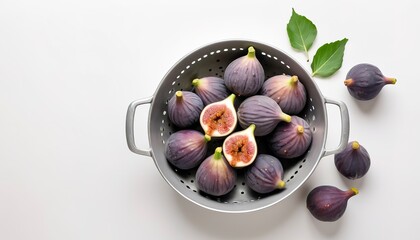 Figs in a colander, organic fruit. Isolated on white background - obrazy, fototapety, plakaty