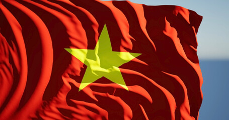 Close-up of the national flag of Vietnam flutters in the wind on a sunny day