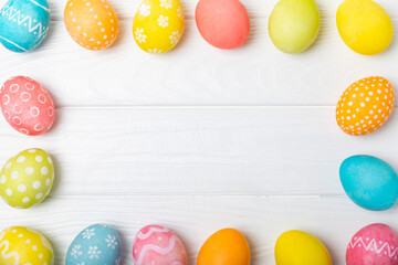 Easter eggs on a bright background. Easter celebration concept. Colorful easter handmade decorated Easter eggs. Place for text. Copy space.